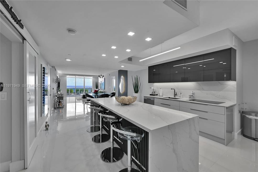 Experience breathtaking sunrise and direct ocean views from this stunning, fully remodeled 3 bedroom, 3 bath residence.