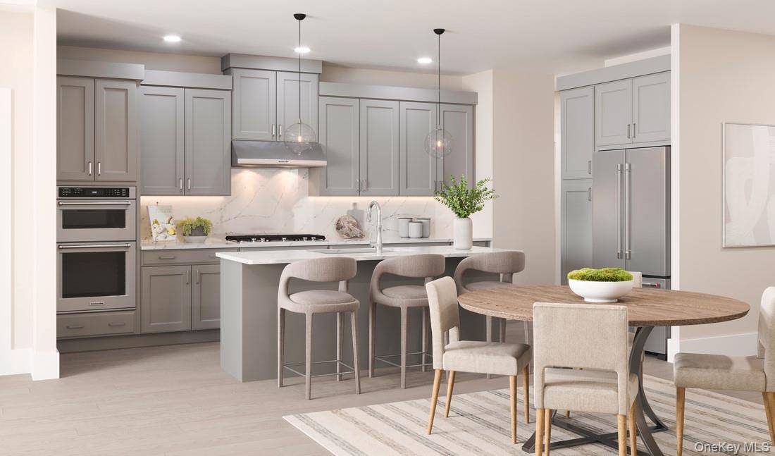 Step into the Mohonk Elite and be welcomed by a stunning two story foyer that flows into the casual dining area and spacious great room, perfect for both everyday living ...