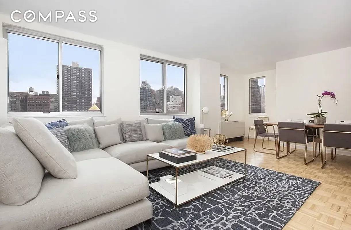 Spacious Sun bathed Two Bedroom Convertible Three bed condominium with washer dryer.