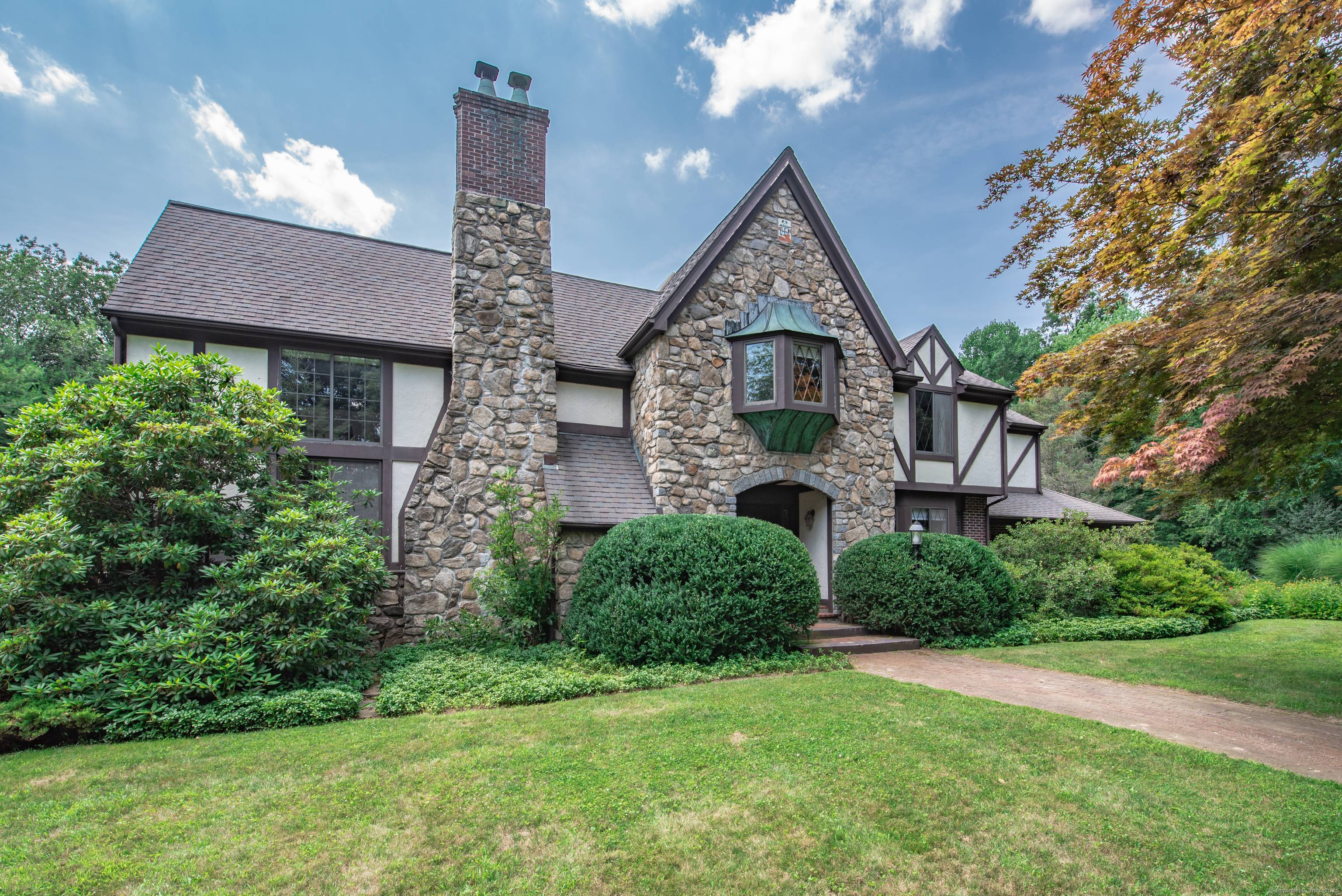 This magical 4, 000 square foot English Tudor with its loft library overlooking the 35' great room featuring a soaring stone fireplace is perfect for weekend escapes from the big ...