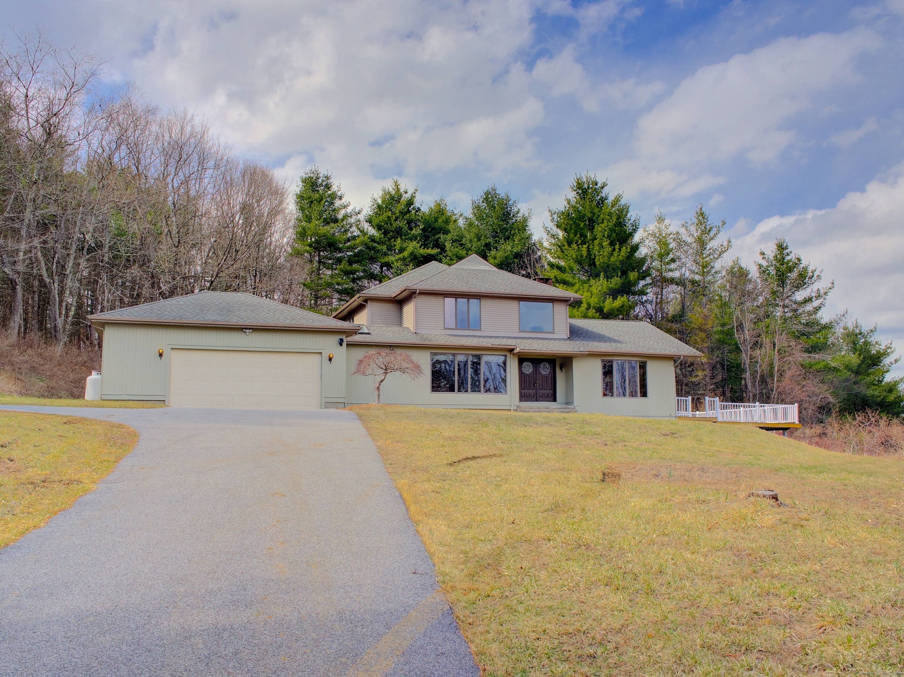 Imagine returning to your private hilltop hideaway everyday after a long days work and relaxing on the spacious back deck enjoying the majestic views from this impressive home.