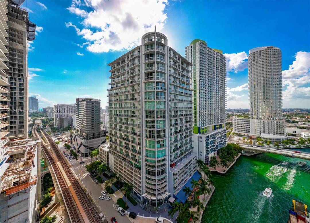 Stunning two story industrial loft in the heart of Brickell featuring dramatic double height ceilings, expansive glass walls, and unobstructed skyline views that transform every room into a visual masterpiece.
