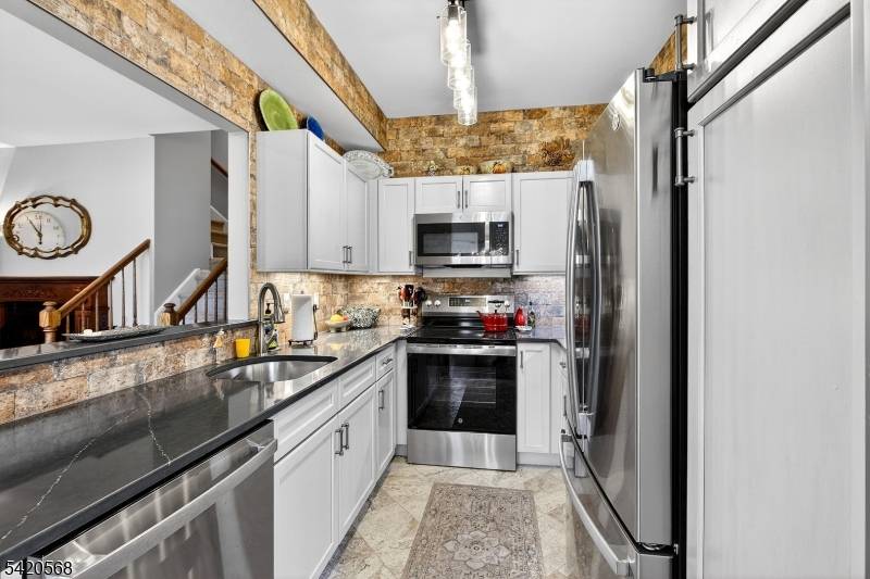 Experience the perfect blend of modern luxury and effortless living in this beautifully updated townhouse, perfectly situated in the highly desirable Crestmont Highlands section of The Hills.