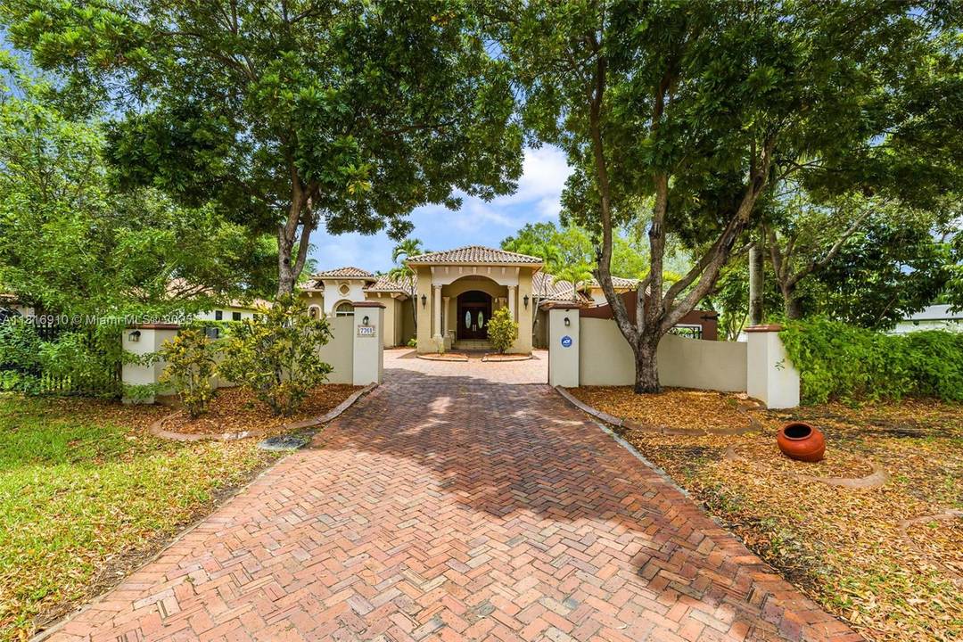 Welcome to an exquisite single family residence at 7761 SW 122nd Ave, Miami, FL, boasting 5, 190 square feet of luxurious living space.