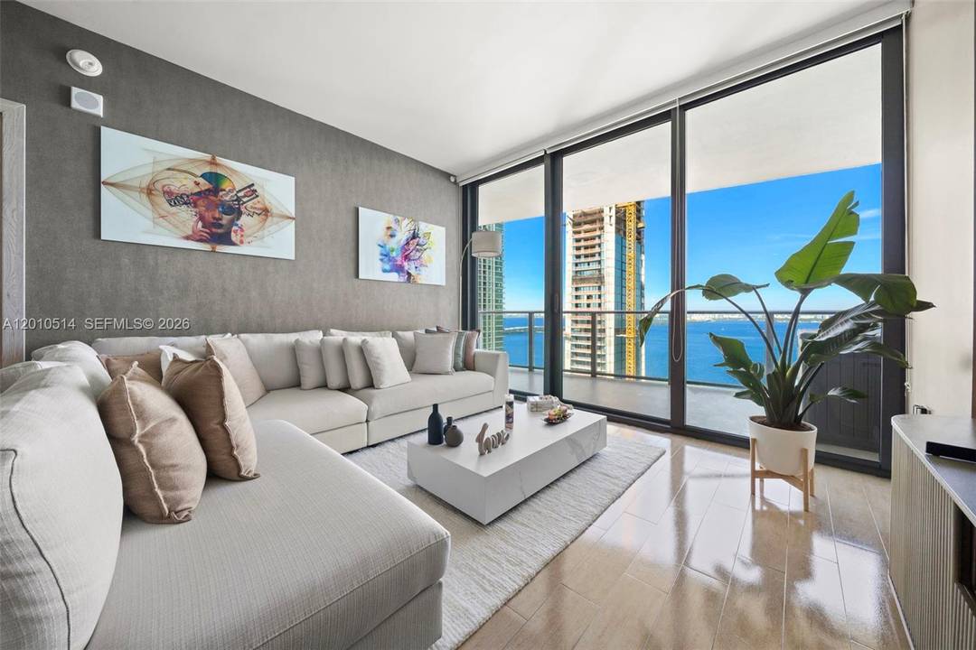 Experience elevated waterfront living at Icon Bay in this beautifully upgraded 2 Bed Den 2 Bath residence in the heart of Edgewater.