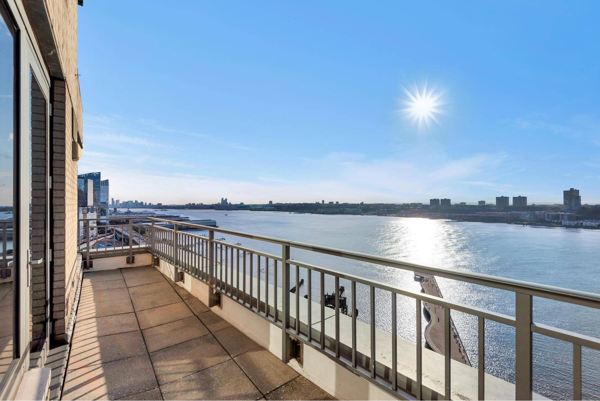 Welcome to this unique southwest facing, two bedroom apartment with a private terrace offering stunning views of the Hudson River, downtown Manhattan, the George Washington Bridge, and New Jersey.