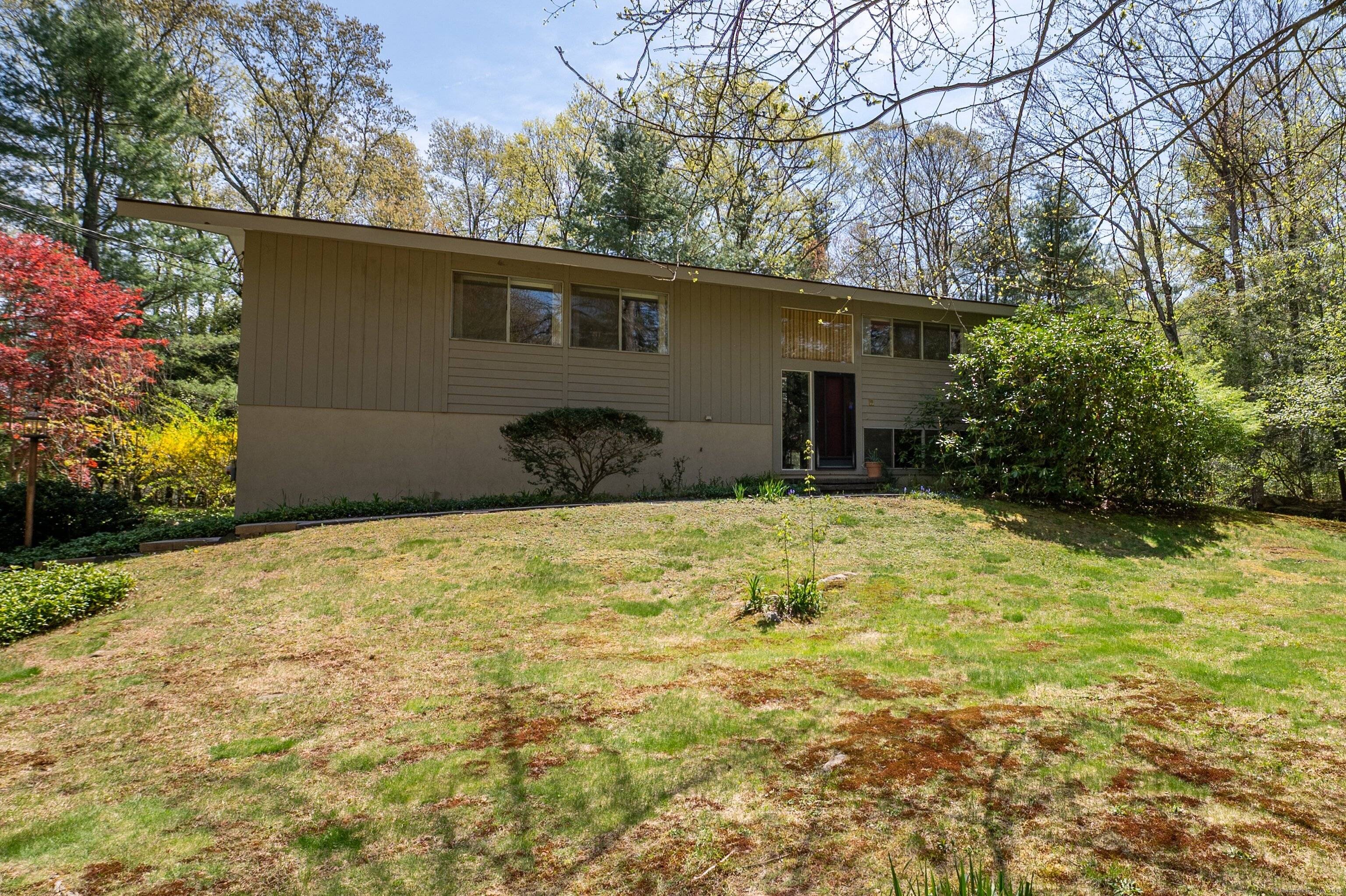 Beautiful level 1. 5 acres surround this Mid Century Modern home, built in 1968.