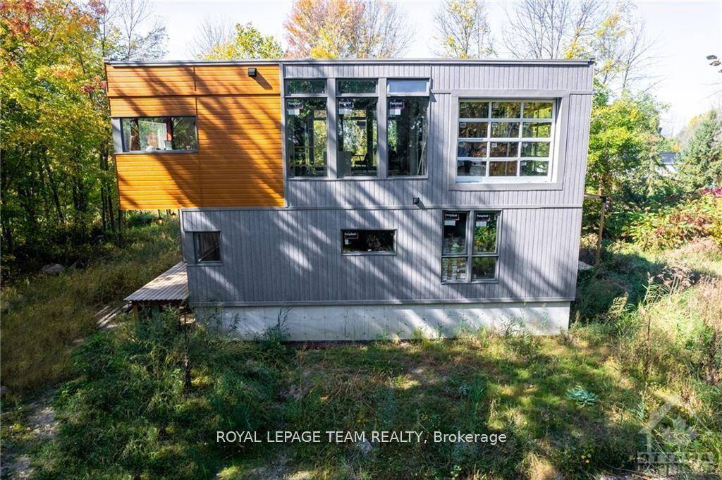 This modern luxury dream home is sitting on a peaceful 1.
