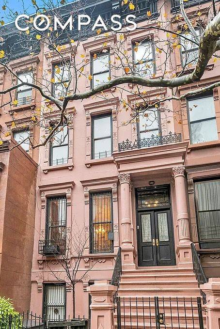 Originally built circa 1925, this meticulously reimagined 19 foot wide two family townhouse with 5 flex 7 bedrooms, 4 baths combines sophisticated design, income potential, and flexible living.