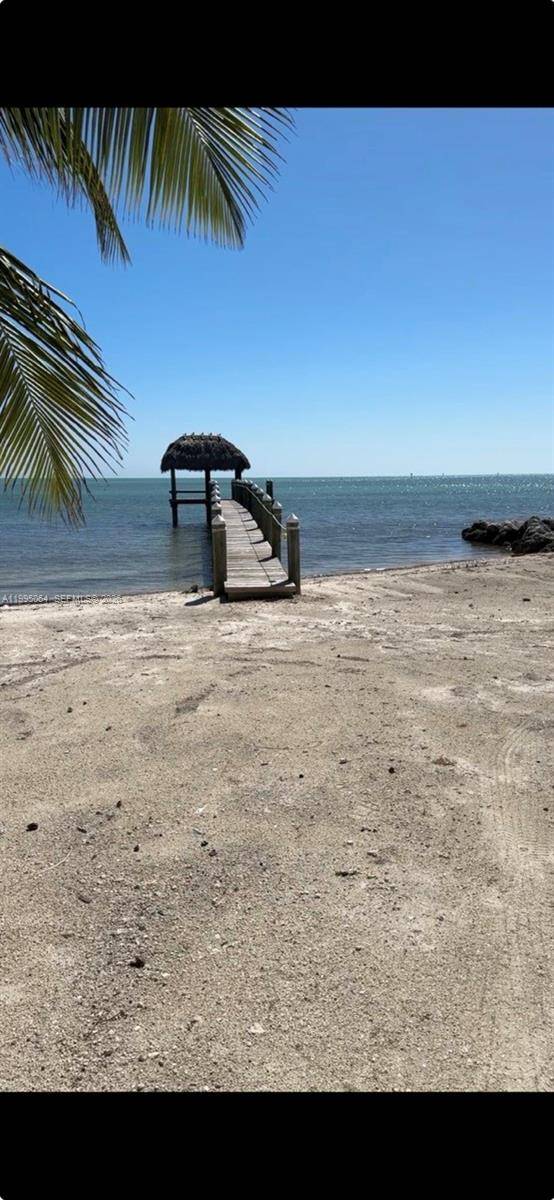 Presenting a breathtaking piece of land in the most desired strip of Islamorada surrounded by multi million dollar homes and directly across from famous Robbie s.