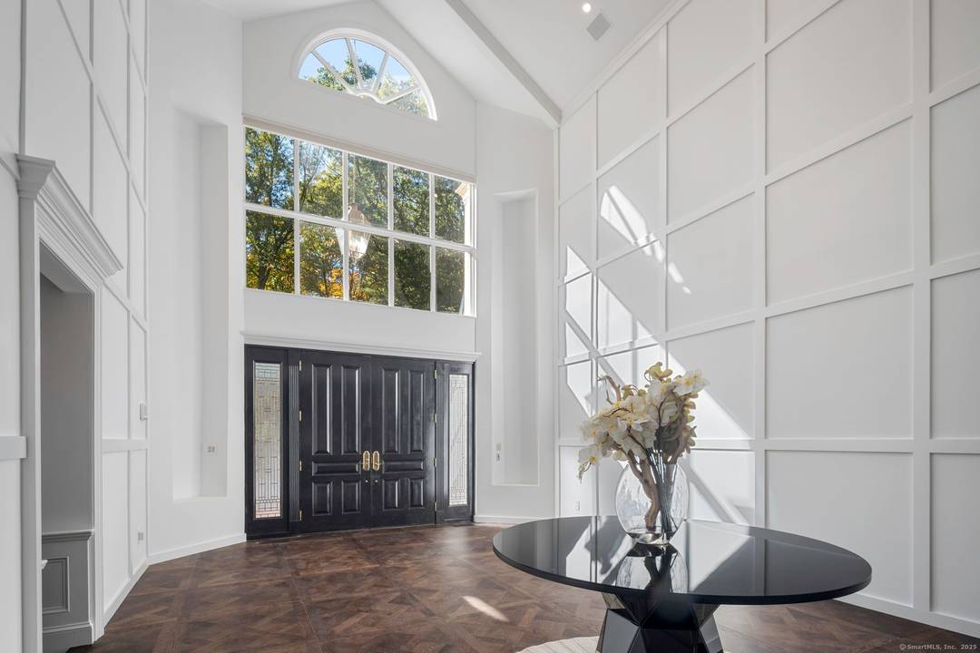 Perched high on a scenic knoll off a private road and set on nearly 4 acres of manicured grounds, this timeless estate is a rare opportunity to own one of ...