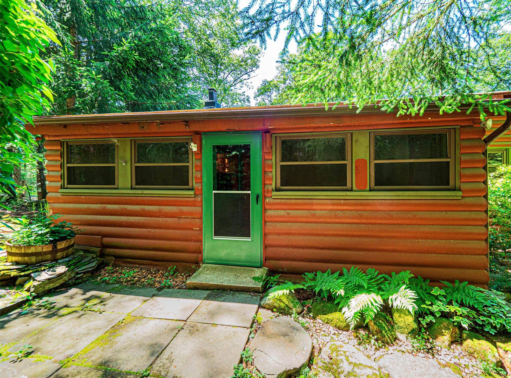 Welcome to 444 Buttermilk Falls Road Located just off Cascade Road, this beautifully maintained log style home offers a perfect blend of rustic charm and modern comfort.