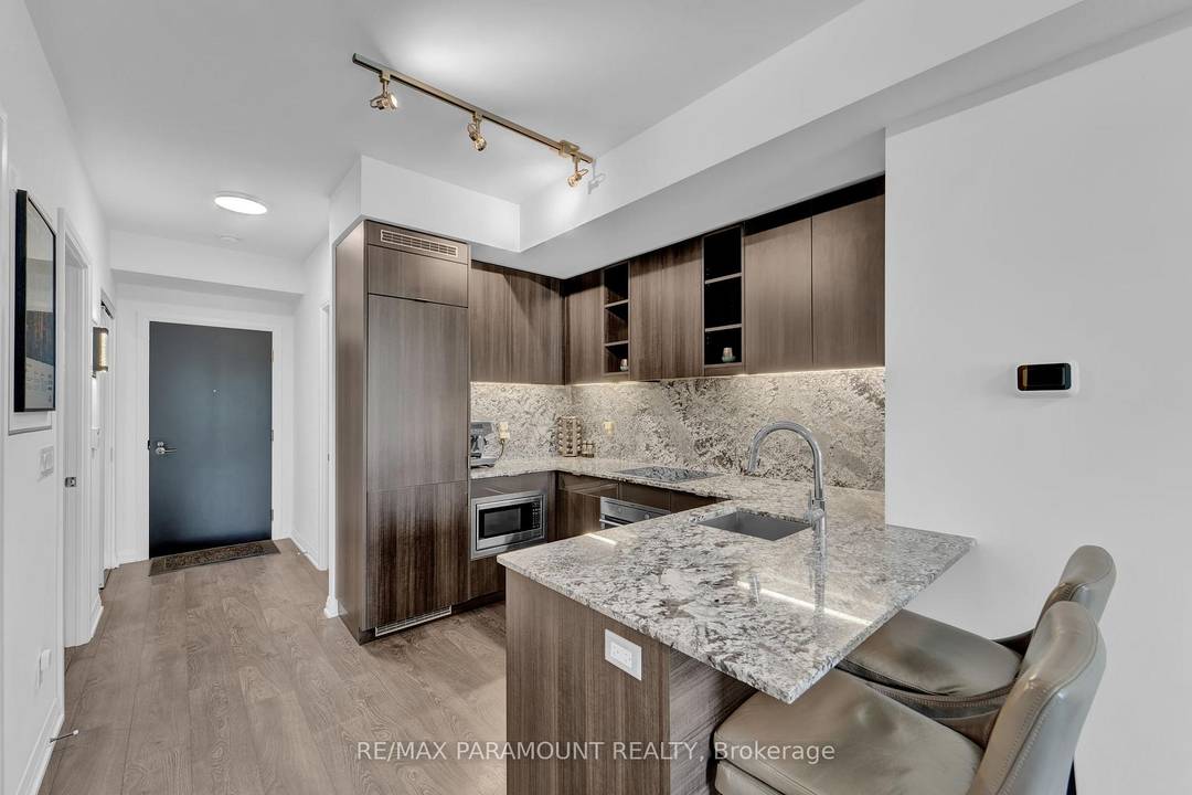 Rare 741 sq ft. 1 1 layout with two complete bathrooms, and fully upgraded, chef inspired kitchen with ample granite counter space and matching backsplash.