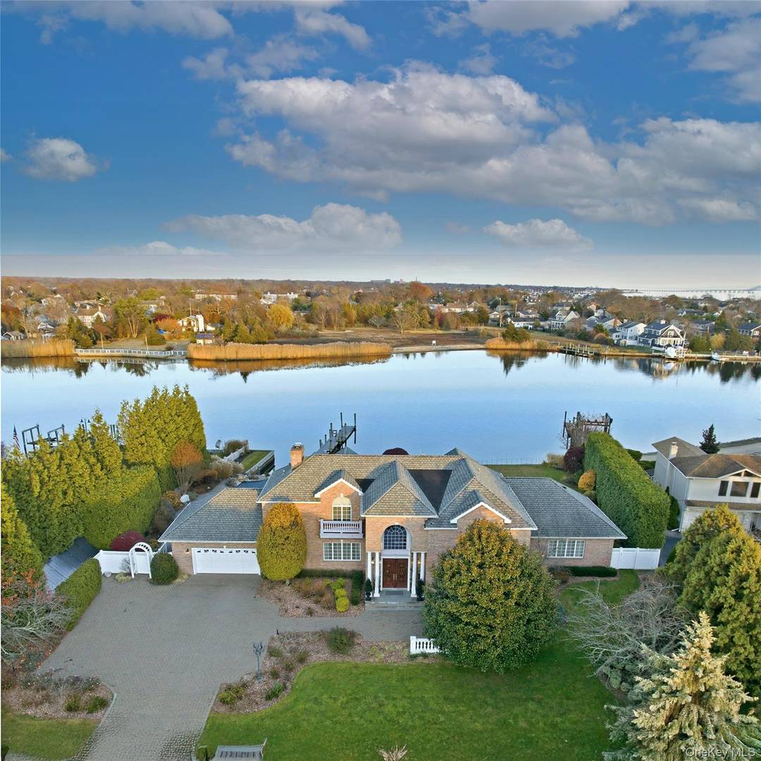 Welcome to an exceptional waterfront retreat, ideally situated along Babylon s largest natural waterway, Carll s River.