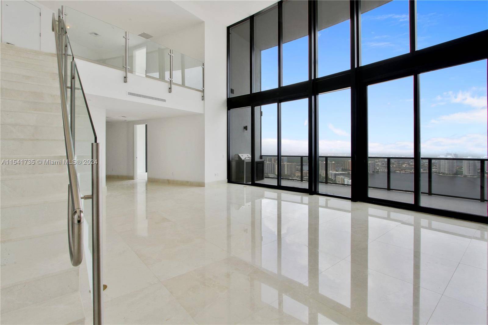 One of the very few duplex residences with dramatic 22ft ceilings.