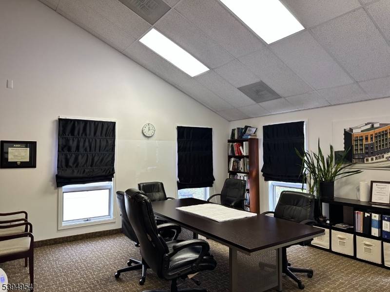 Elevate your business space with this spacious office condo in Mountain Lakes Business Park with prime highway location !