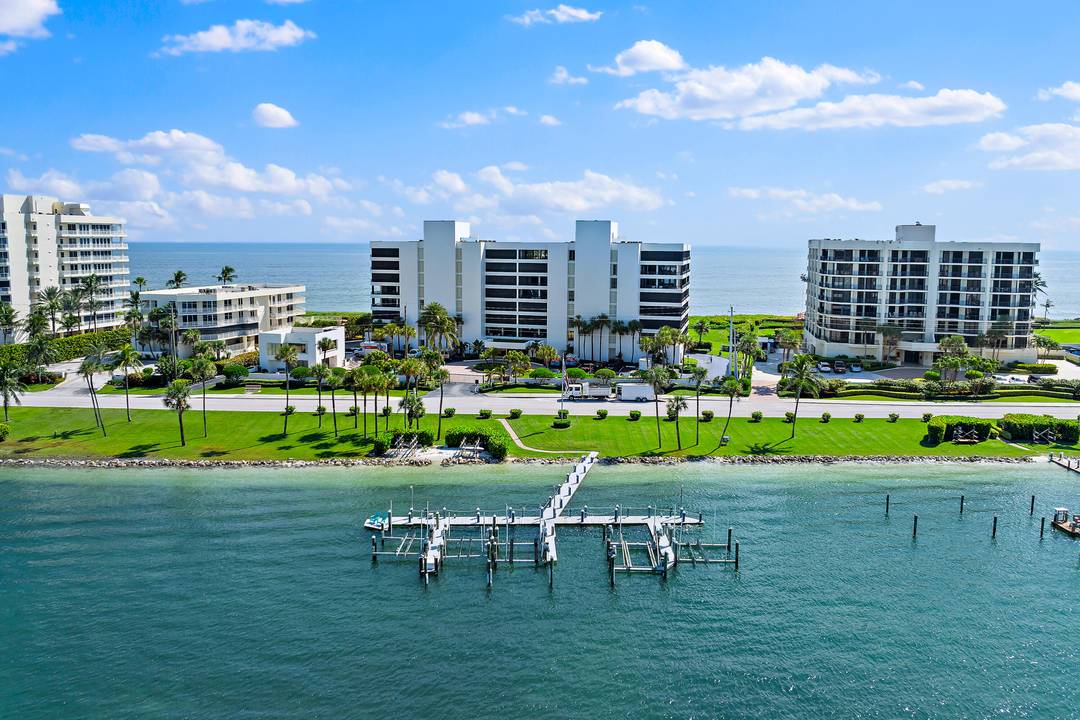 Jupiter Island coastal living awaits in this north facing end unit with pass through views of the ocean and intracoastal.