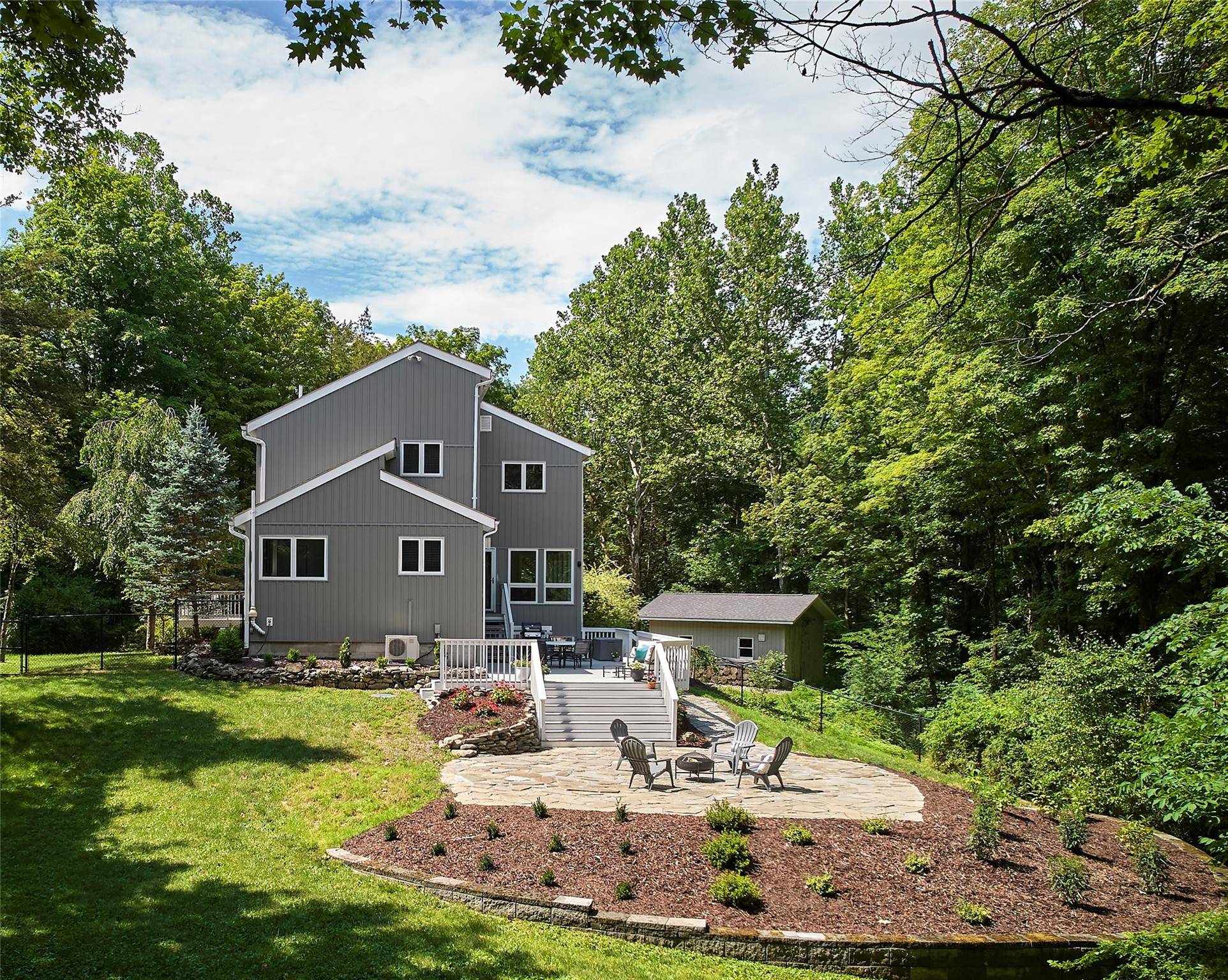 Perched at the crest of a pillared drive, this stunningly reimagined contemporary home masterfully fuses modern design with inviting warmth and everyday comfort.