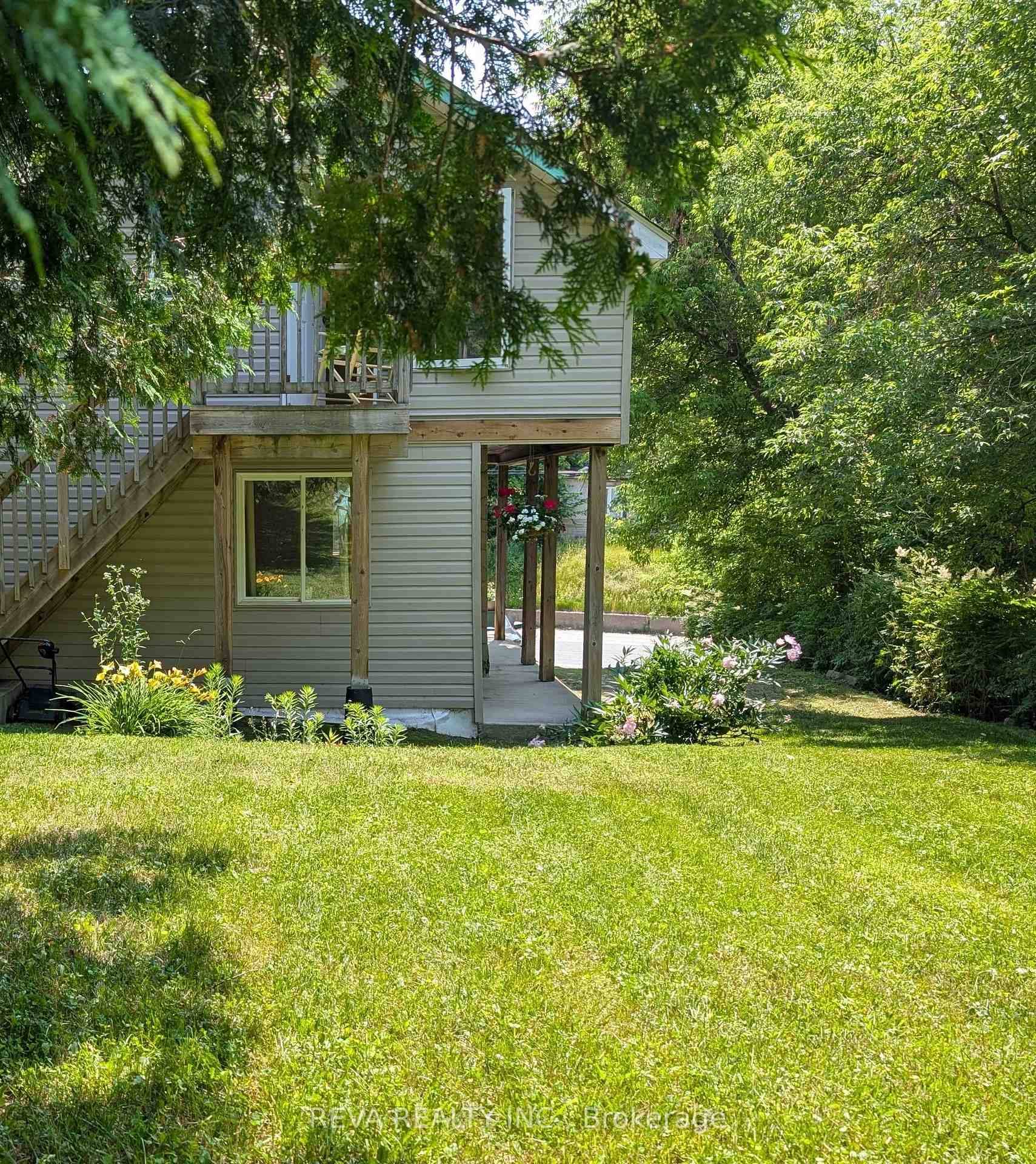Bancroft living this property offers the best of both worlds with a sunny south facing house backing onto a lovely forest ravine with a creek running through it.