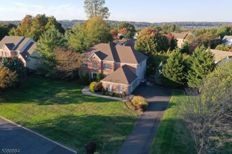 Welcome to your dream home in Green Brook's serene and highly desirable, Top of the World neighborhood !