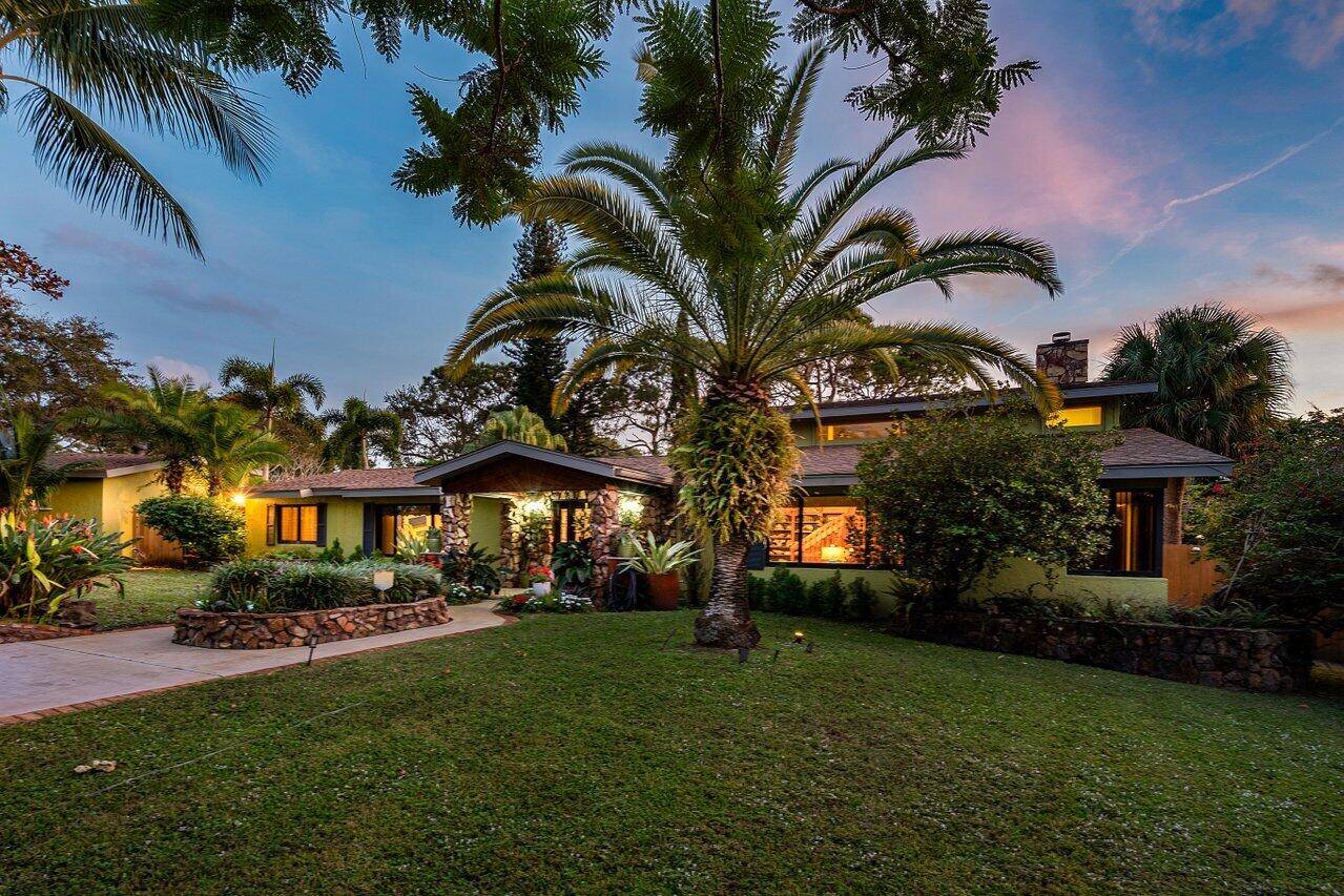 Discover Southern charm and modern elegance on over an acre of lush, private grounds along Boynton Beach's coveted High Ridge Road.
