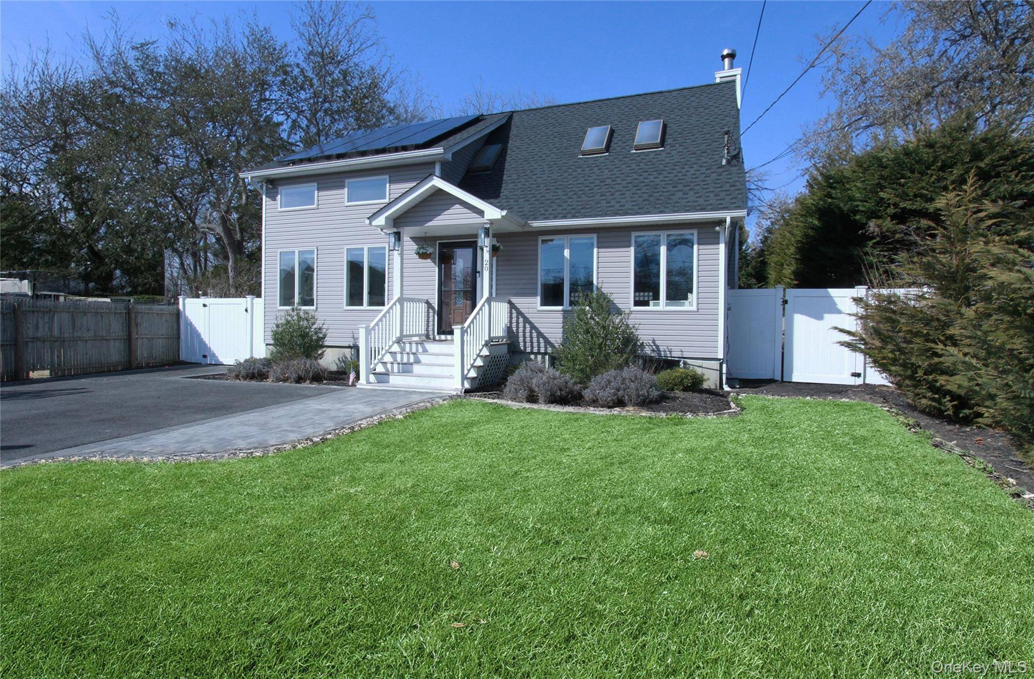 Welcome to 20 Lincoln Boulevard, East Moriches, where elegance meets comfort in this turnkey residence.