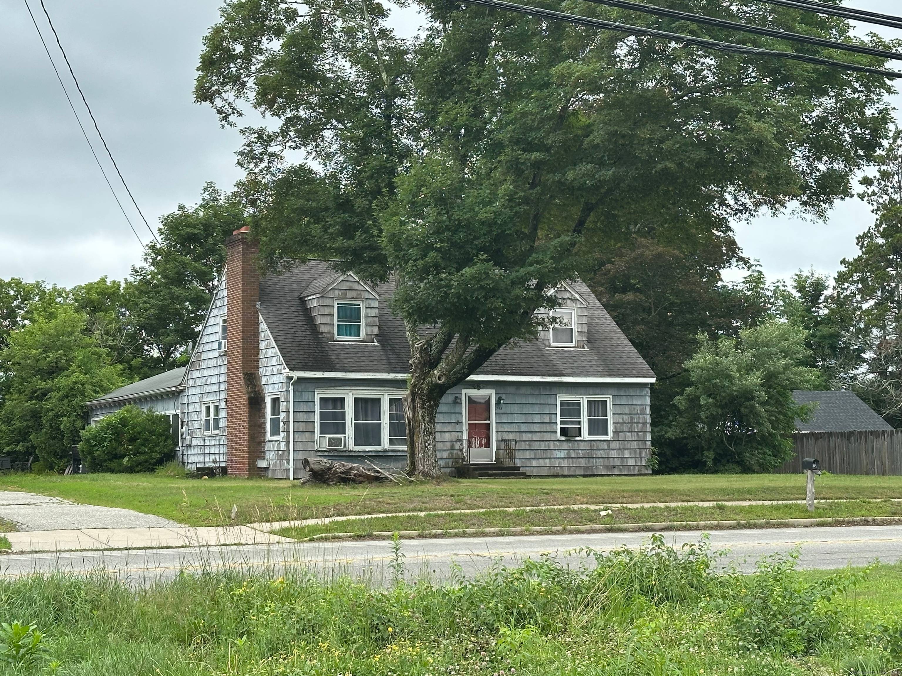 This strategically located property offers a prime commercial redevelopment opportunity with substantial road frontage directly adjacent to a busy traffic light, providing excellent visibility and exposure to steady vehicle flow.