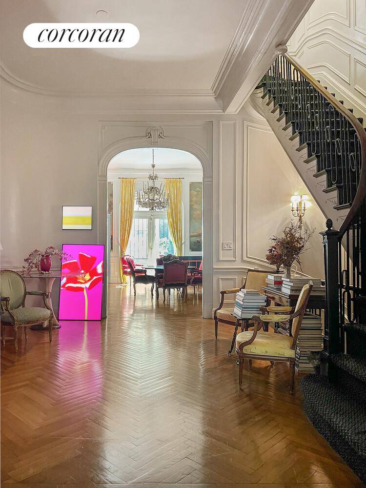 This turn of the century four story townhouse exudes the charm, elegance, and grandeur of its vintage.