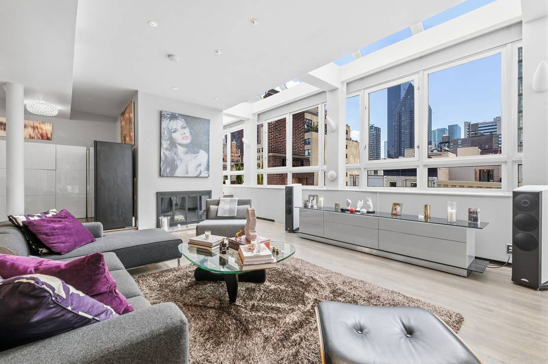 Low monthlies and exceptional scale define this bright, south facing duplex penthouse perched atop a well serviced cooperative in Midtown East.