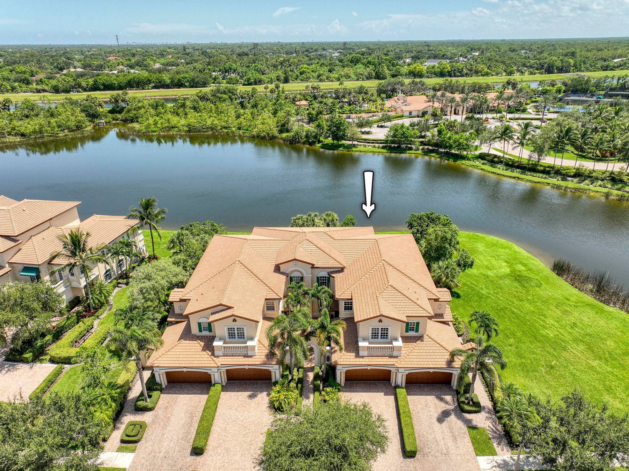 Breathtaking views could be yours from this exceptional single story carriage home in the prestigious Jupiter Country Club.