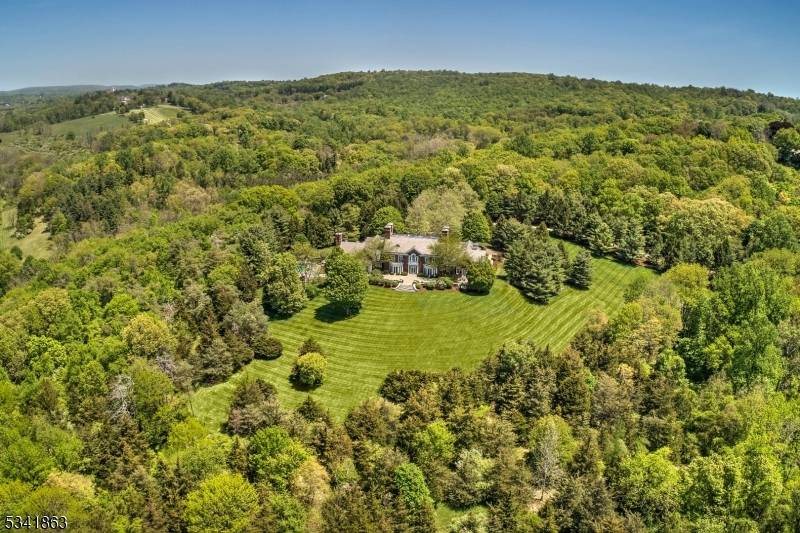 PRICE IMPROVEMENT ! Privately secluded on 32 acres overlooking westerly hillsides, this distinguished estate is unique in its capability to protect and endure.