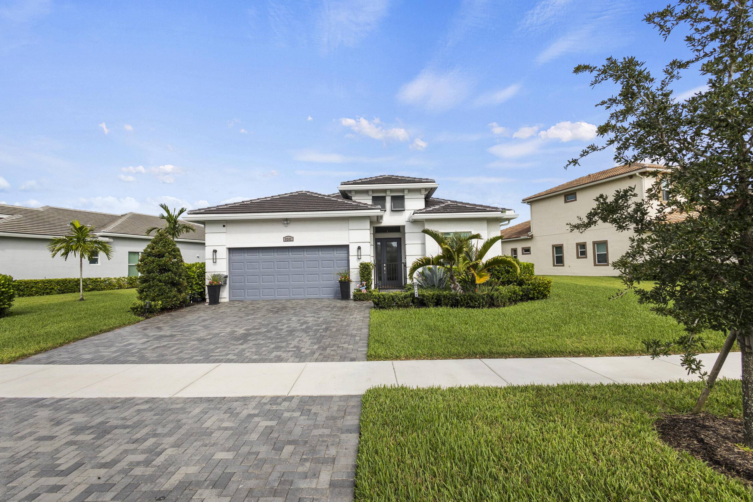 Step into this stunning 3 bedroom, 3 bath lakefront home with a versatile den in the gated Verano community, where every sunset paints the sky over your private patio.
