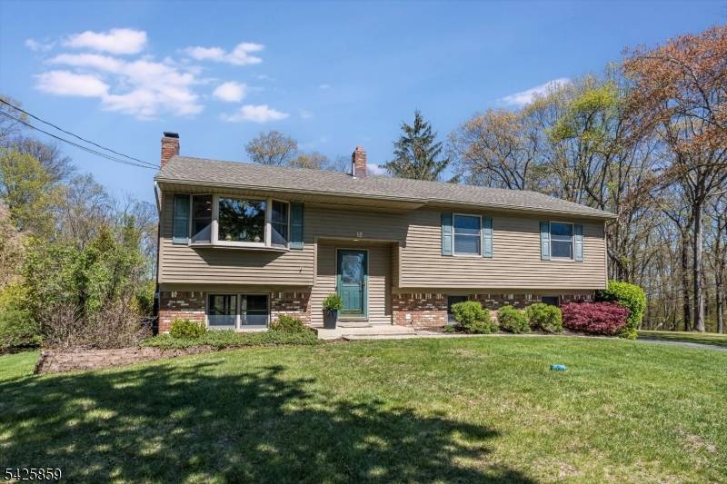 Location and condition blend together seamlessly in this beautifully maintained four bedroom home located on a quiet cul de sac in one of Flanders' most desired neighborhoods.