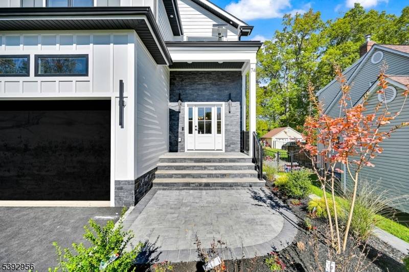 Welcome to this stunning 6 bed, 5 bath custom new construction home across 3 levels on a flat lot with attached 2 car garage.