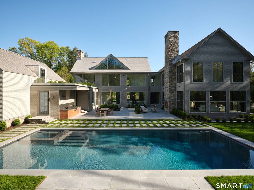 Privately set within Darien's coveted Tokeneke neighborhood, 45 Old Farm is a remarkable custom estate by award winning builder Oliver Wilson.