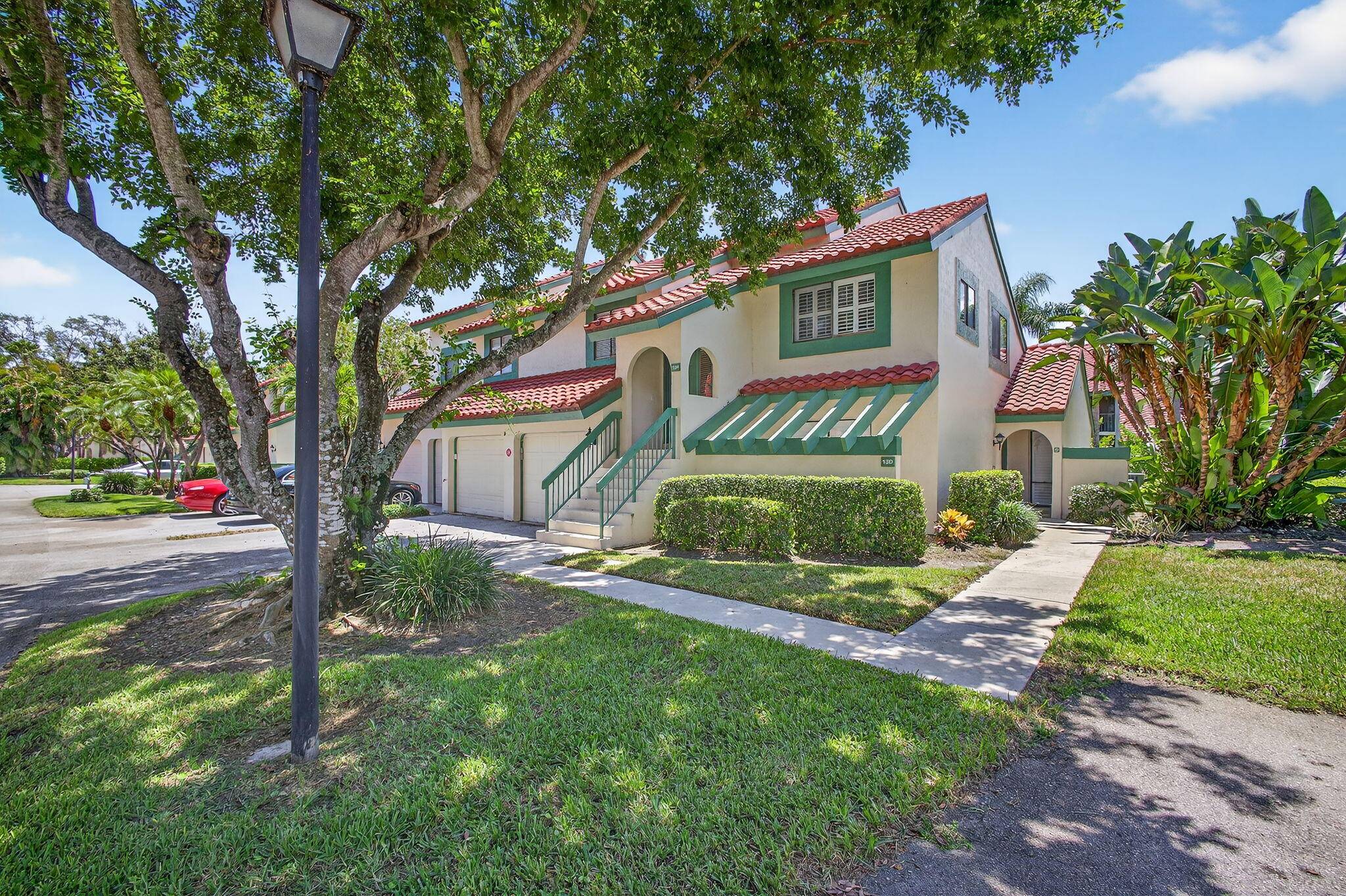 GORGEOUS and meticulously maintained three bedroom CBS first floor condo located in the highly sought after Lexington Green of PGA National !