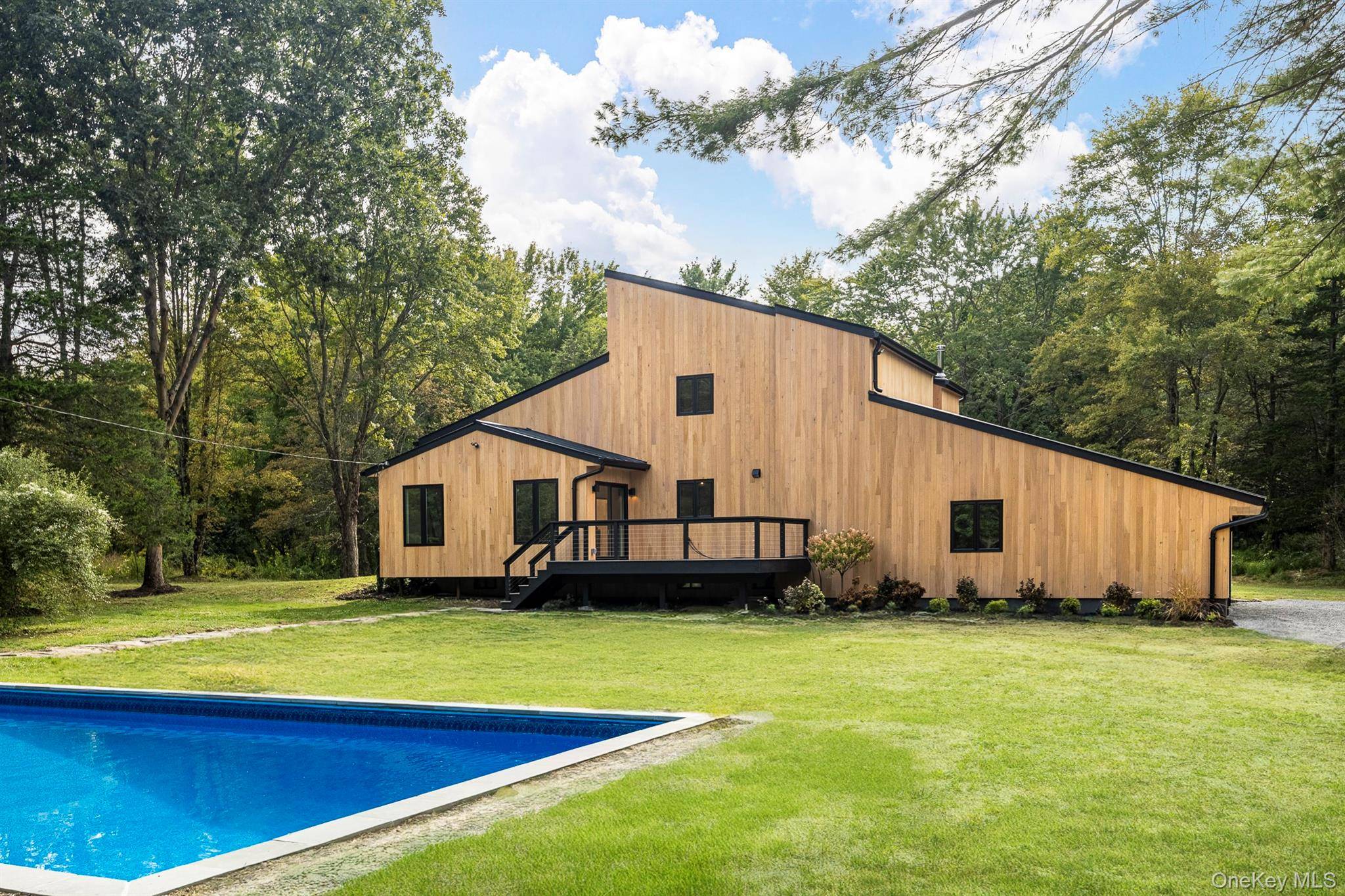 Elegance, quality, and peace of mind define this fully renovated, high end modern retreat in Salt Point, in Millbrook School District.