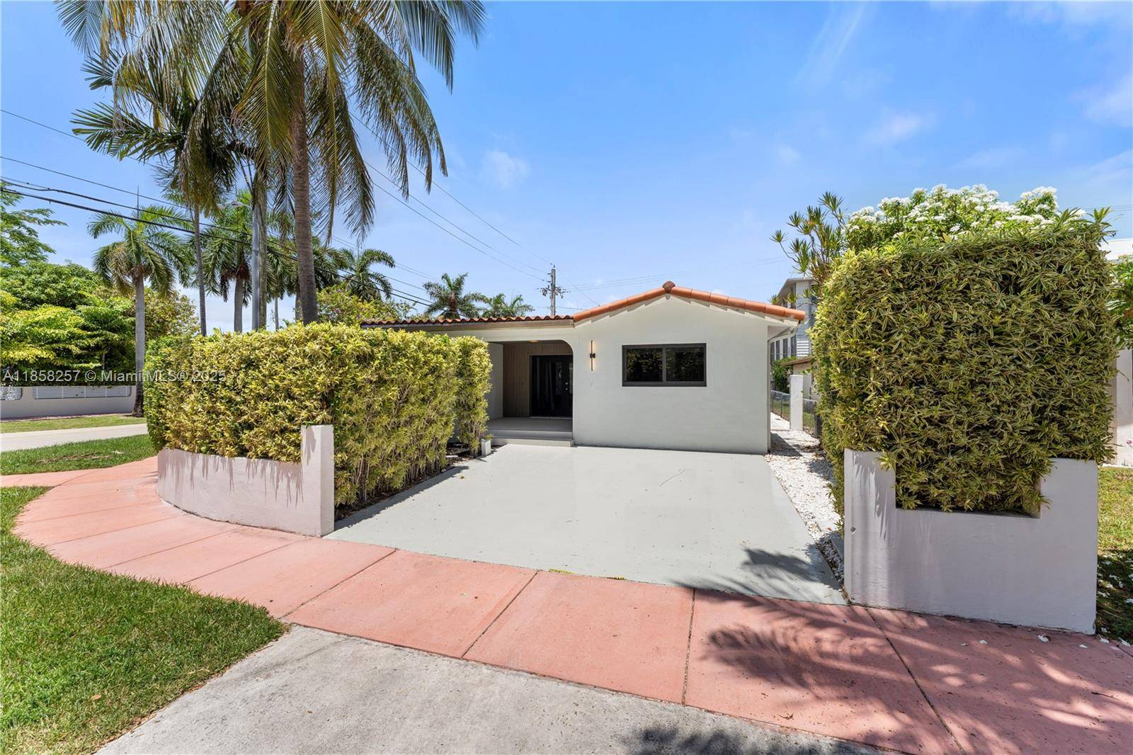 Experience Miami Beach living at its finest in this stunning 3BR 2BA home with a detached 1BR 1BA studio, perfectly situated on a desirable corner lot.