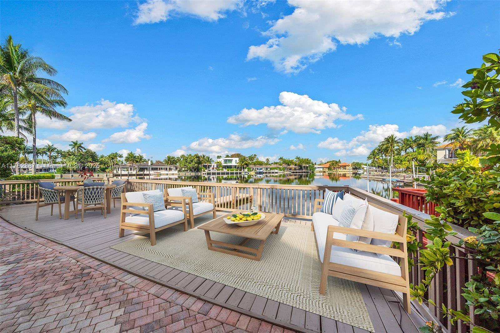 Experience the waterfront lifestyle in this two story waterfront home, perfectly situated on the coveted bulb section of the water in Harbor Islands.