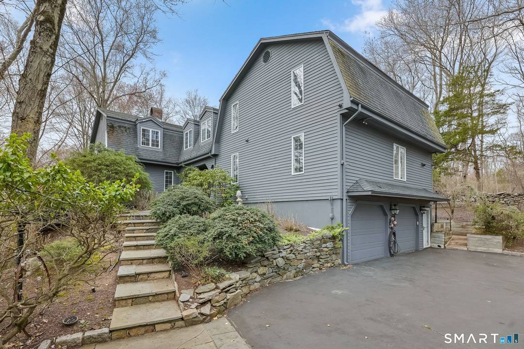 Set back from the street and introduced by a brick entry with space to sit and unwind, this expansive, first time offered Colonial reflects a level of craftsmanship and scale ...