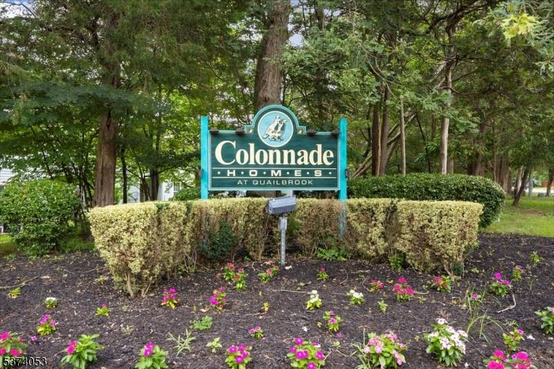 Welcome home to an inviting second floor end unit nestled in Colonnade at Quailbrook.