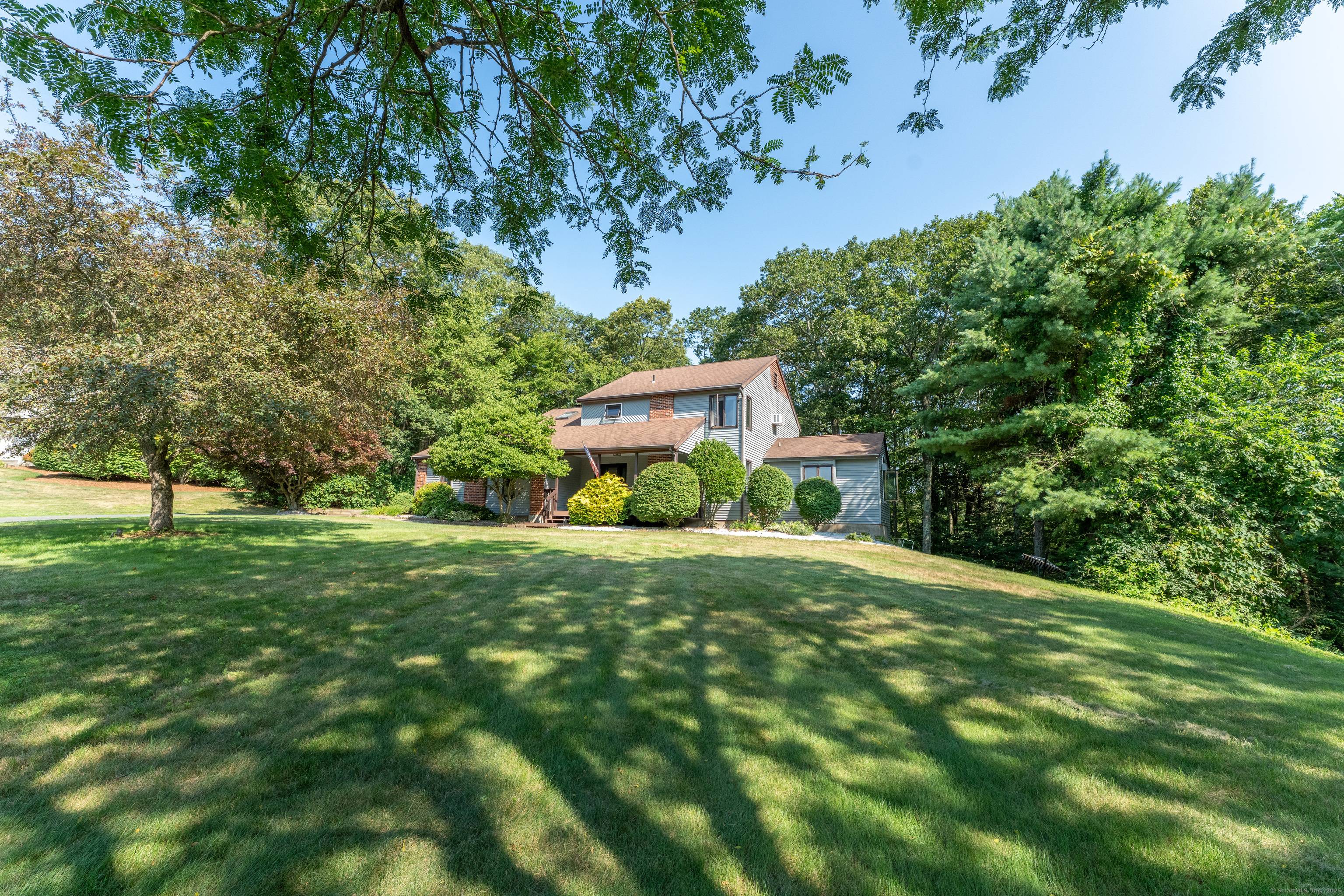 Welcome to this beautifully maintained Colonial Contemporary home situated on a generous 1.