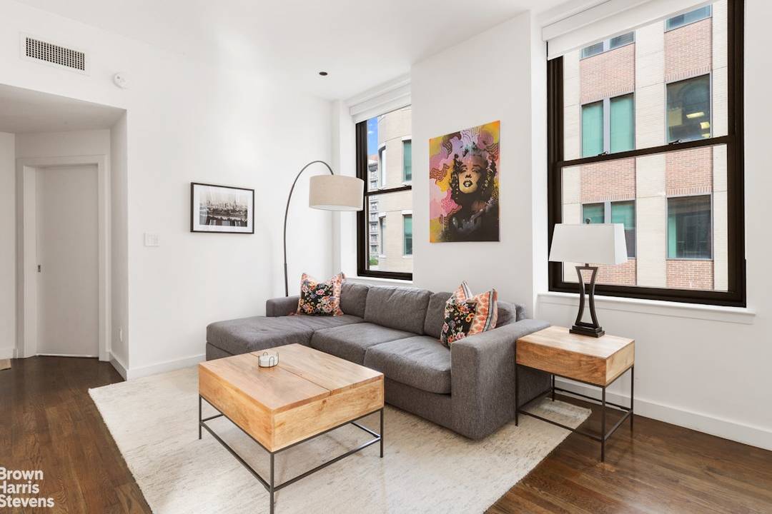 This apartment is available to be purchased entirely furnished The Apartment A bright downtown loft style one bedroom awaits you, where modern elegance meets comfort.