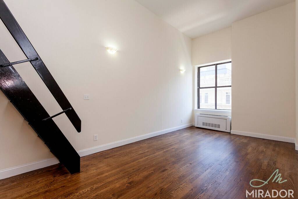 Huge loft style duplex on charming tree lined West 16th Street.
