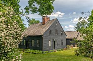 Aexpanded, restored and remodeled homestead sited on 6 acres.