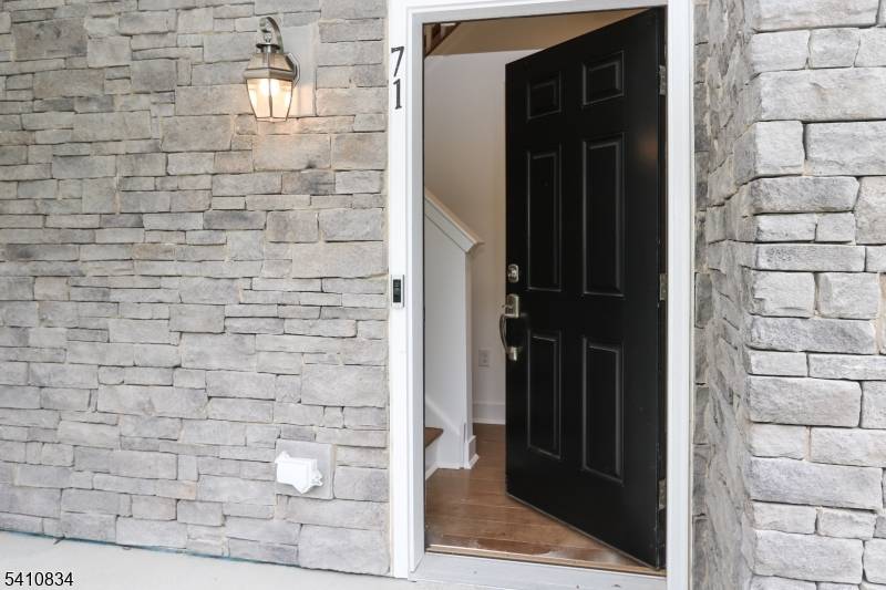 Welcome to this must see Hampton style end unit at Collections in Morris Plains.