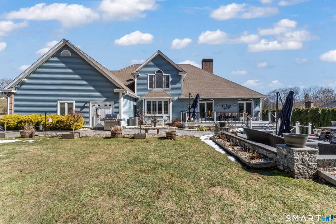 Stately custom brick Colonial set on a private lightly wooded 1.