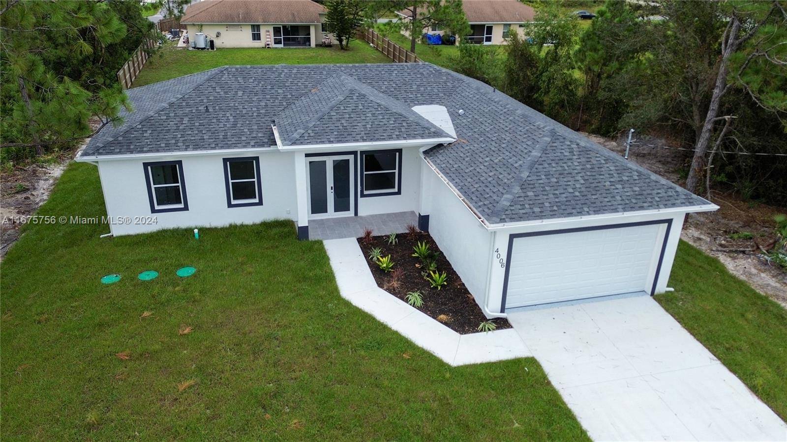 Welcome to this stunning brand new construction home in Lehigh Acres, finishing soon !