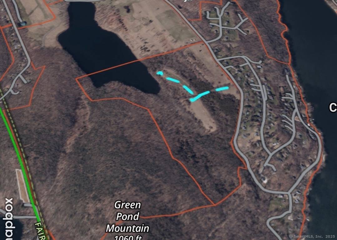 Discover an unparalleled opportunity on an elevated unspoiled lot on Candlewood Mountain Rd, New Milford, CT, where sophistication meets tranquility.