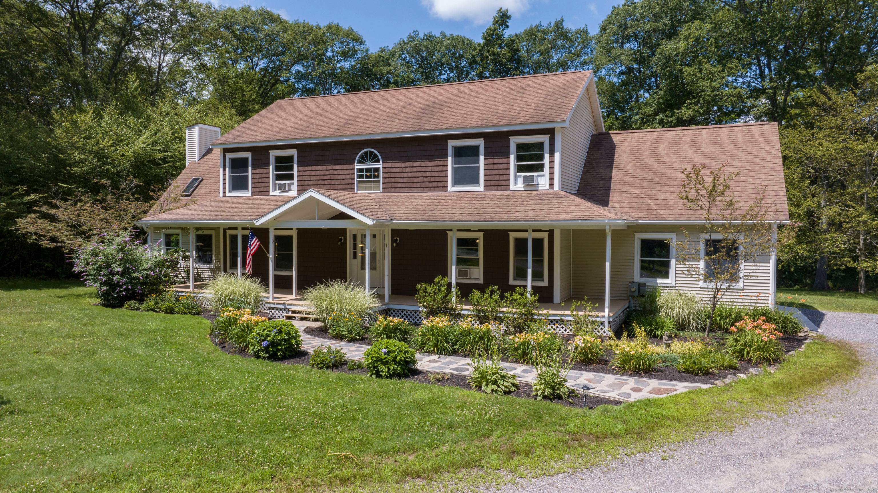 This beautiful sprawling custom colonial is set on 9 acres of land at the end of a winding long driveway and surrounded by open area.